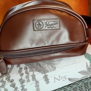 An original Penguin By Munsingwear toiletry bag. NWT